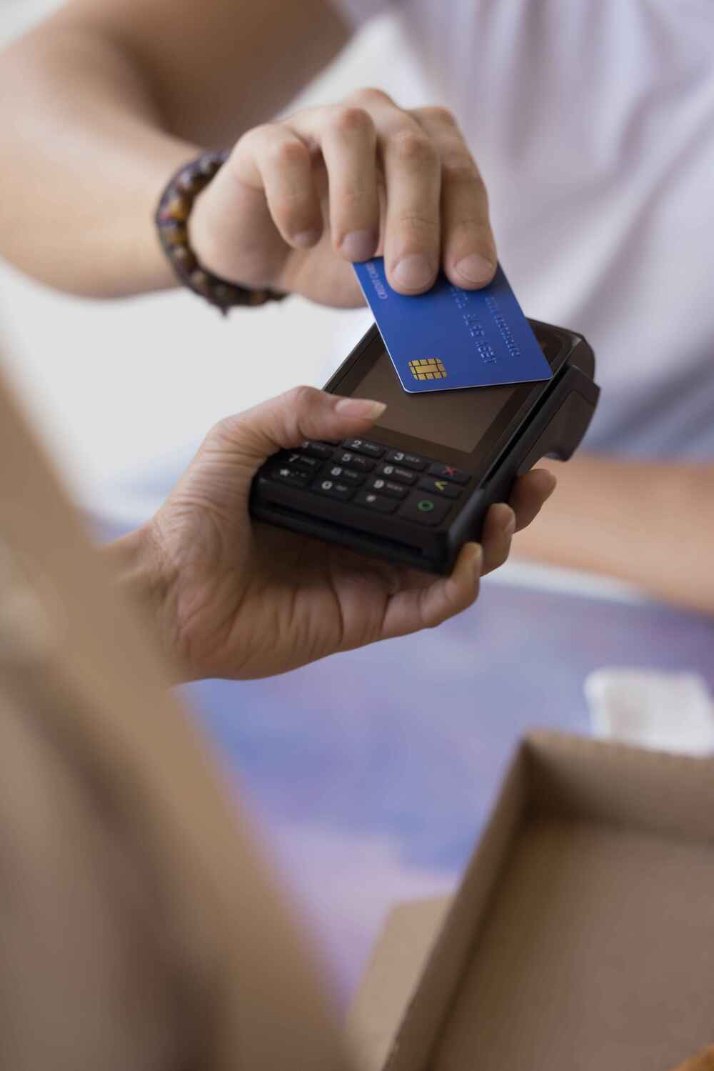Contactless card transaction using POS terminal to trigger authorization process.